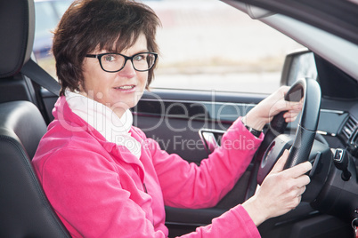 Middle-aged woman in the car