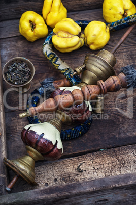 Still life with retro hookah and quince