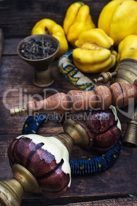 Still life with retro hookah and quince