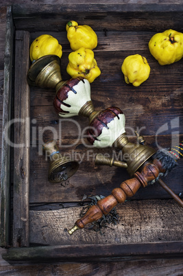 Still life with retro hookah and quince