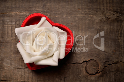 White rose in heart shaped box