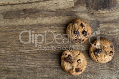 Brown cookies on wooden background