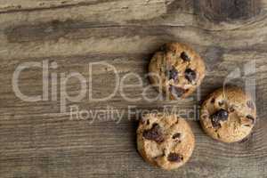 Brown cookies on wooden background