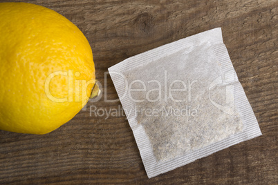 Lemon teabag on wooden background