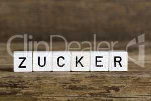 The German word sugar written in cubes