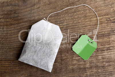 Teabag on wooden background