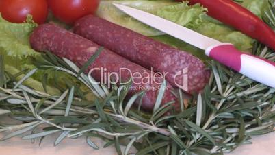 Slice sausage and fresh herbs