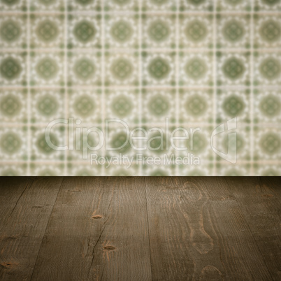 Wood table top and blur vintage ceramic tile pattern wall