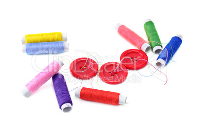 sewing thread and buttons isolated on white background