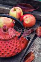 Stylish kettle and an apple