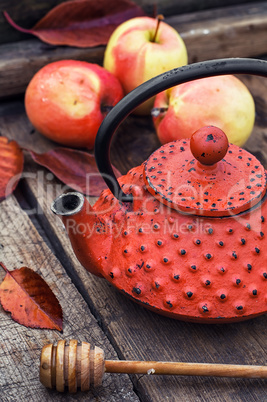 Stylish kettle and an apple