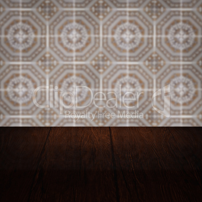 Wood table top and blur vintage ceramic tile pattern wall