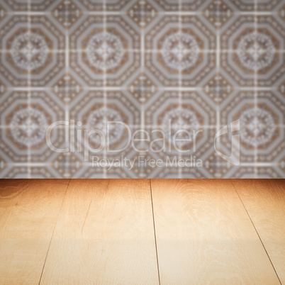 Wood table top and blur vintage ceramic tile pattern wall