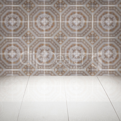 Wood table top and blur vintage ceramic tile pattern wall