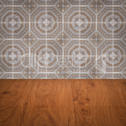 Wood table top and blur vintage ceramic tile pattern wall