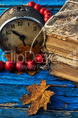 old-fashioned alarm clock and coral beads