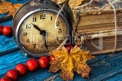 old-fashioned alarm clock and coral beads