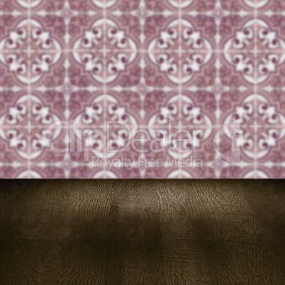 Wood table top and blur vintage ceramic tile pattern wall