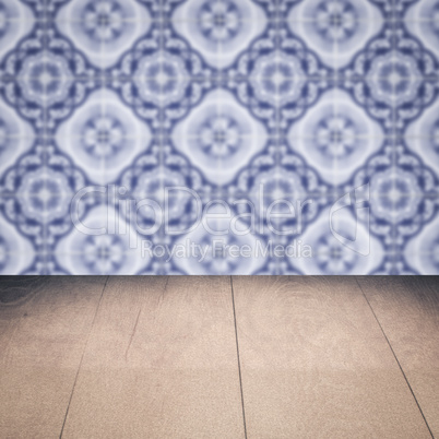 Wood table top and blur vintage ceramic tile pattern wall