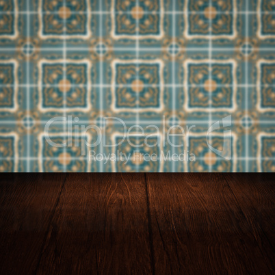 Wood table top and blur vintage ceramic tile pattern wall