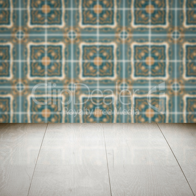 Wood table top and blur vintage ceramic tile pattern wall Wood table top and blur vintage ceramic tile pattern wall