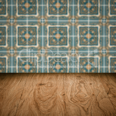 Wood table top and blur vintage ceramic tile pattern wall