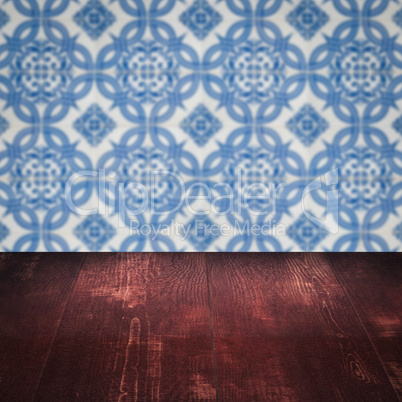 Wood table top and blur vintage ceramic tile pattern wall
