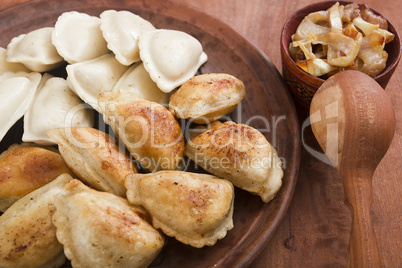 Vareniks fried in butter and cooked in water