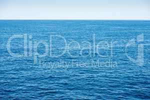 Blue ocean background with blue sky