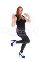Woman dancing in black tights.