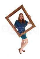 Woman holding a  picture frame.