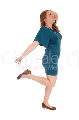 Woman dancing is dress.