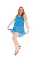 Woman dancing in blue dress.