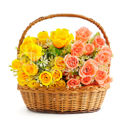 silk flowers in basket isolated on white background
