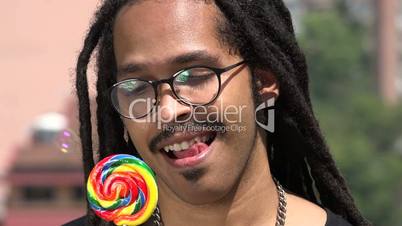 Young African Man With Lollipop