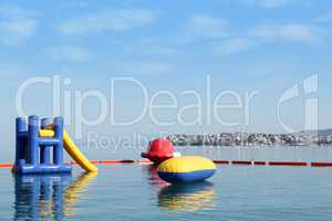 beach toys and equipment floating on sea Neos Marmaras Sithonia