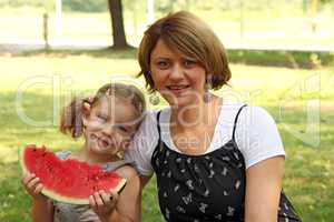 mother and daughter with watermelon