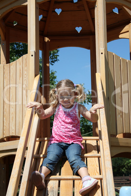 happy little girl on playground