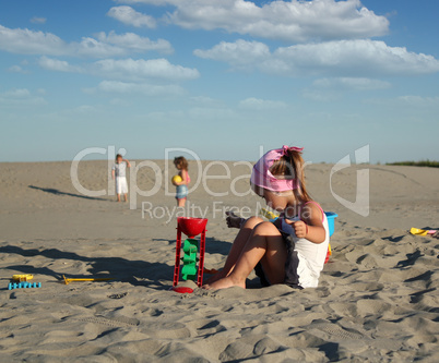 little girl playing with sand