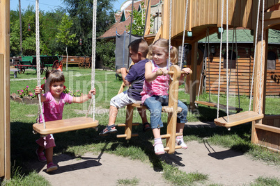 three children on playground three children on playground