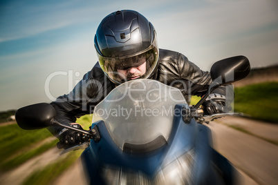 Biker racing on the road