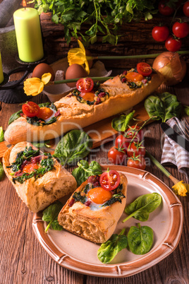 farmer baguette filled with egg, bacon and spinach