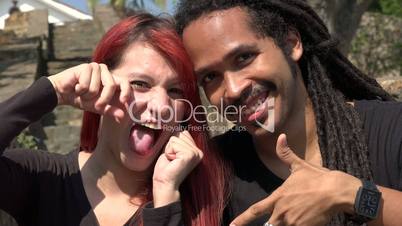 Happy Female Redhead Teen And African Man Posing