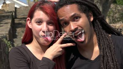 Female Redhead And African Man Acting Silly