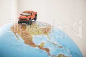 Offroad car on globe