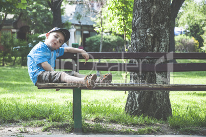 Little boy on a bench