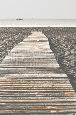 Beach and wooden trail.