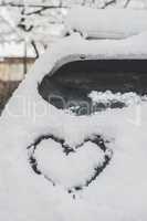 Snow heart shape on car