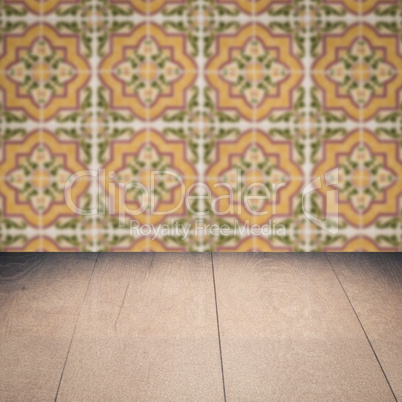 Wood table top and blur vintage ceramic tile pattern wall