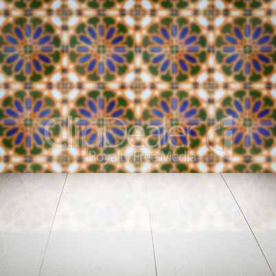 Wood table top and blur vintage ceramic tile pattern wall